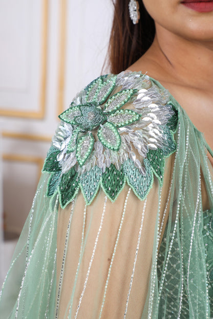 Green Heavy Lehenga With A Crop Top In Long Cape Embroidered Sleeves