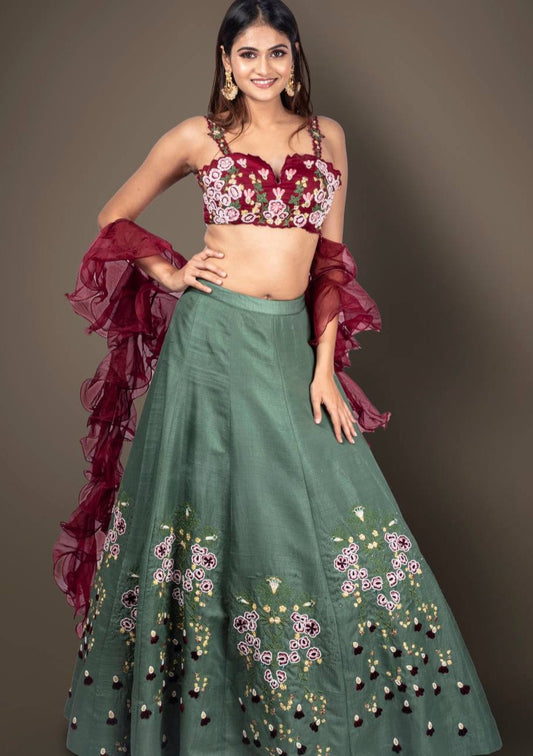 Green Skirt And Maroon CropTop With Multicoloured Resham And Cutdana Embroidery