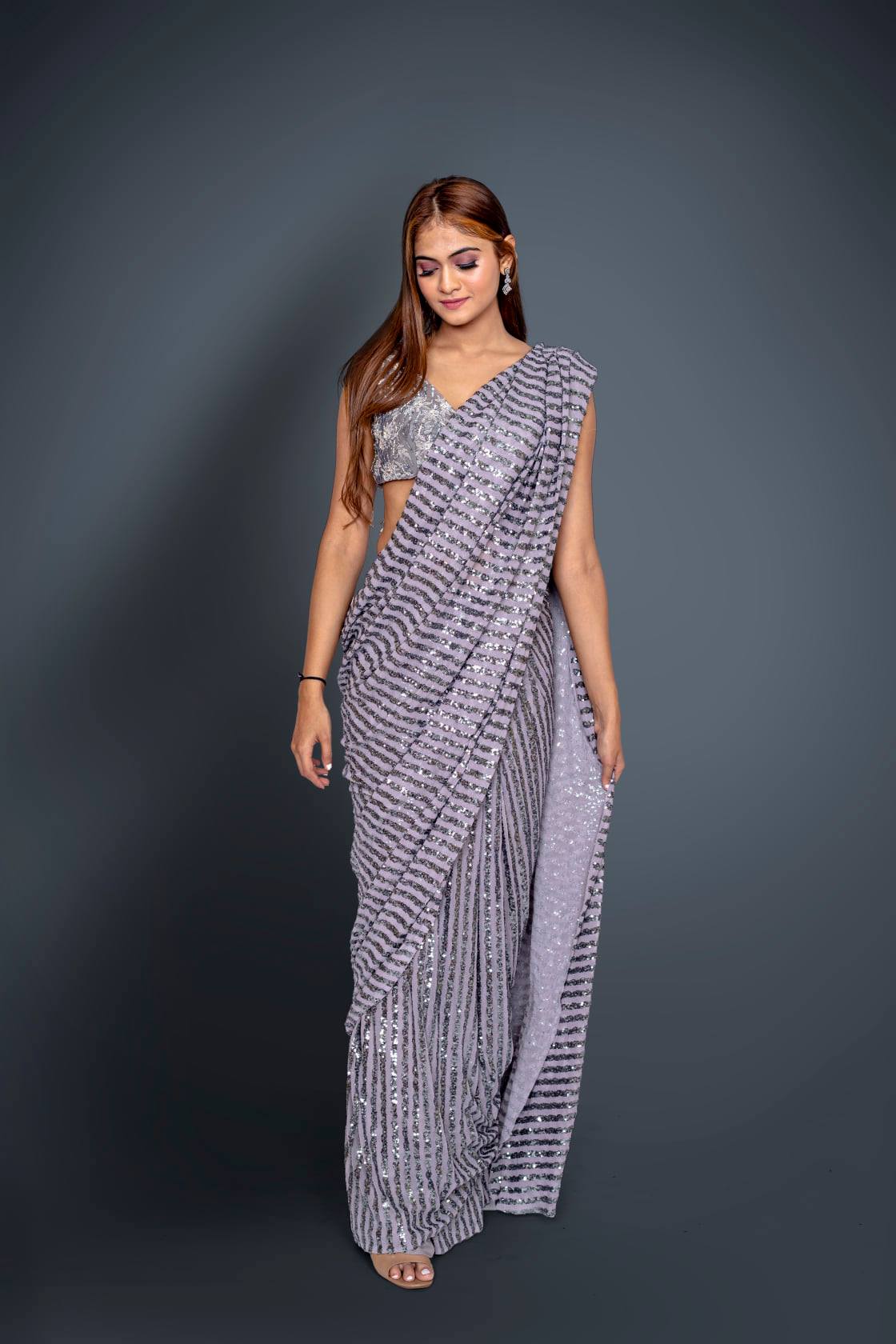 Grey Pleated Saree In Net With Sequin Embellished Stripes And A Blouse