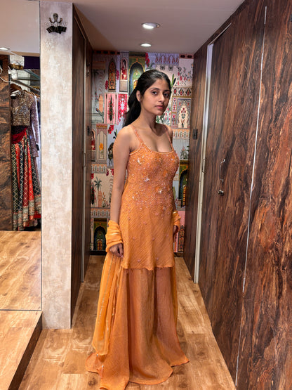 Sunset Peach plazo with a short kurti and dupatta