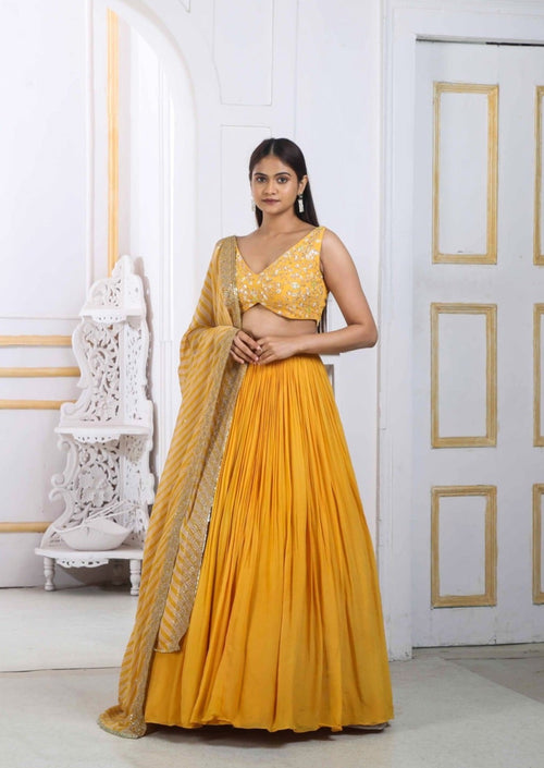 Mustard Yellow Lehenga Choli With Handwork Blouse And A Georgette Dupatta