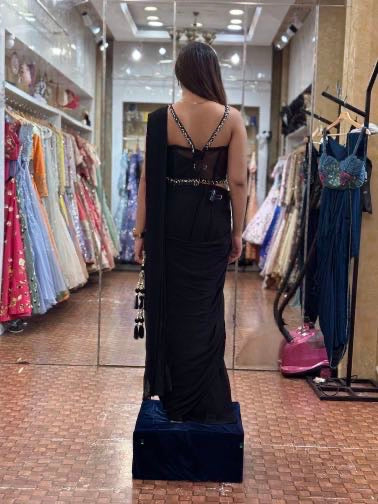 Black saree with corset blouse