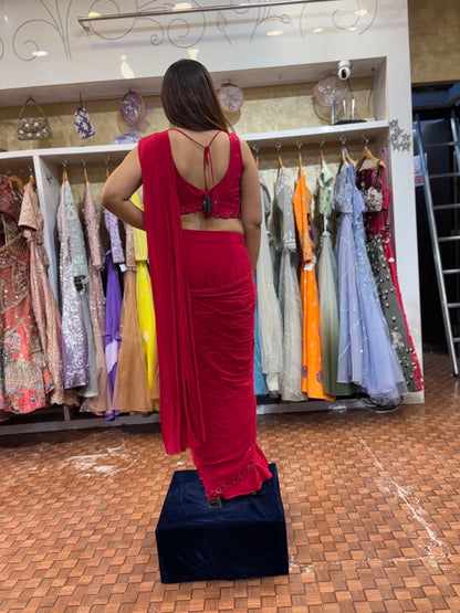 Red pleated saree