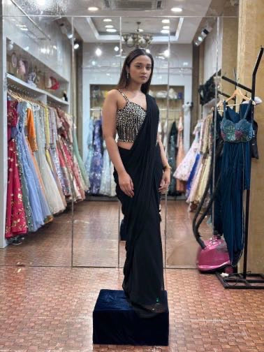 Black saree with corset blouse