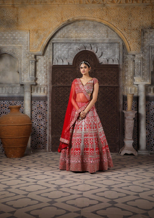 Red bridal embellished with Zari, zardozi,  katdana, and more